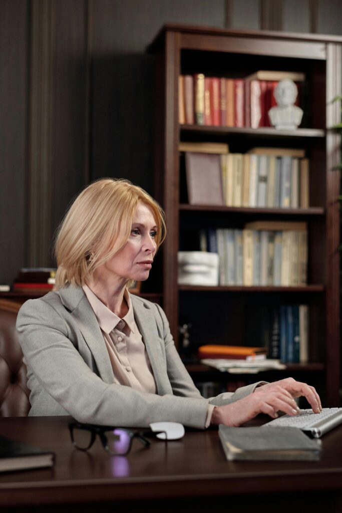 A confident businesswoman working at her desk in a stylish office environment.